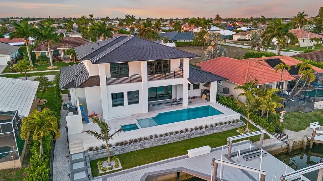 Aerial view of a landscaped backyard with pool